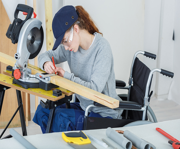 Disabled,Female,Worker,In,Wheelchair,In,A,Carpenters,Workshop
