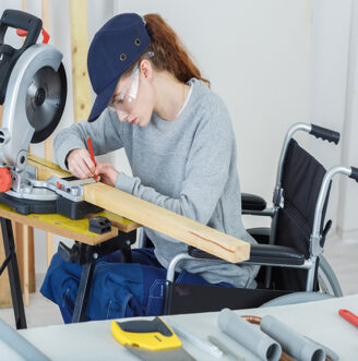 Disabled,Female,Worker,In,Wheelchair,In,A,Carpenters,Workshop