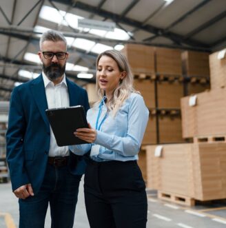 Female,Engineer,And,Male,Production,Manager,Standing,In,Modern,Industrial