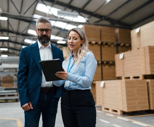 Female,Engineer,And,Male,Production,Manager,Standing,In,Modern,Industrial