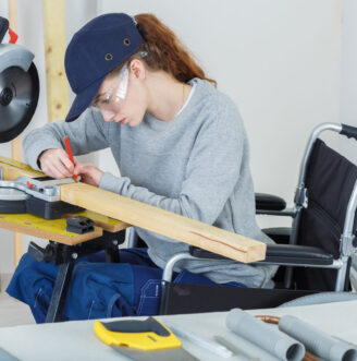 Disabled,Female,Worker,In,Wheelchair,In,A,Carpenters,Workshop