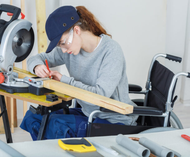 Disabled,Female,Worker,In,Wheelchair,In,A,Carpenters,Workshop